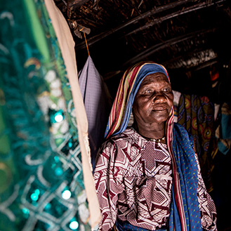 A woman standing in her home. Links to Gifts by Will A woman standing in her home. Links to Gifts by Will