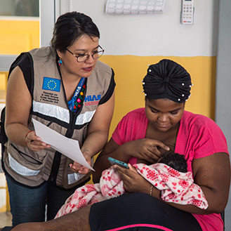 An HIAS worker helping a mother and her child. Links to Gifts That Pay You Income An HIAS worker helping a mother and her child. Links to Gifts That Pay You Income